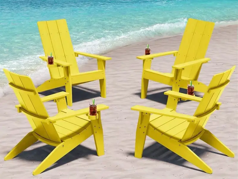 Bulk yellow weather-resistant HDPE Adirondack chairs set OF 4 on sandy beach shore for coastal resort seating