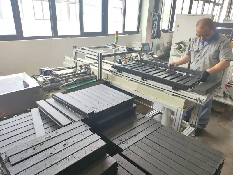 Worker assembling customized HDPE chair parts at Supereco HDPE Adirondack chairs manufacturer facility