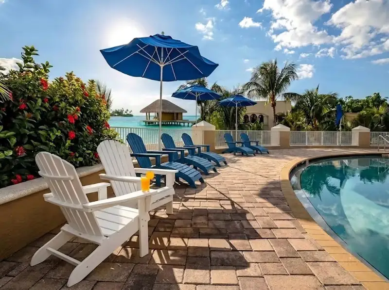 White HDPE Adirondack chairs and blue HDPE Adirondack Chair with Ottoman for resort