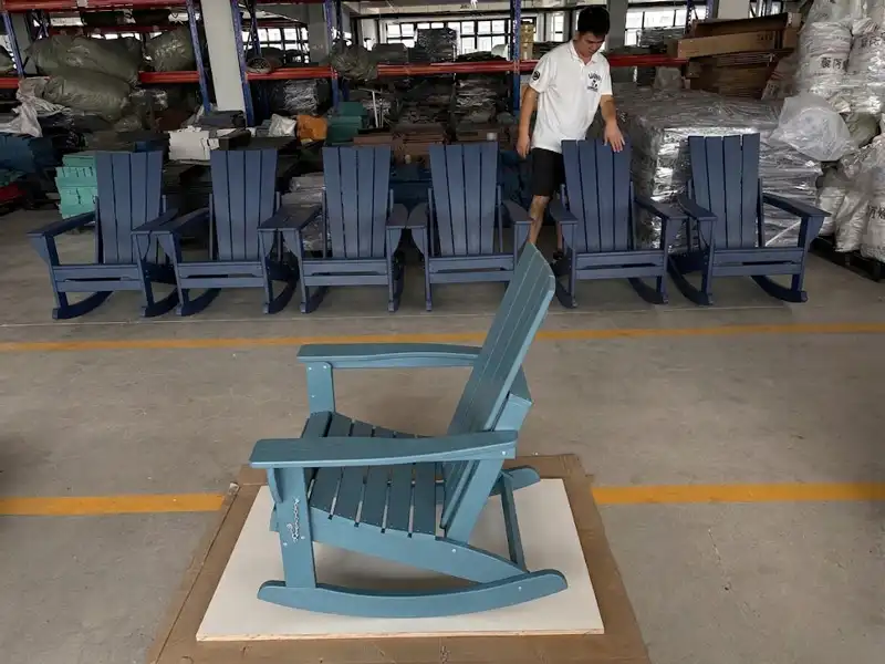Blue HDPE rocking Adirondack chairs displayed in manufacturing workshop for global wholesale sourcing