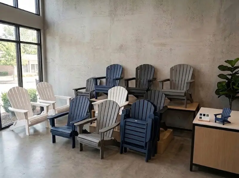 Commercial showroom layout displaying a variety of foldable HDPE Adirondack chair colors and models for retailers